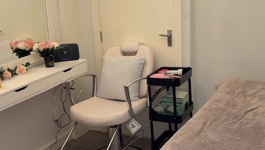 Tranquil treatment room at Beautybycodiex_ in Warrington, England, GB, featuring a comfy chair and floral decor.