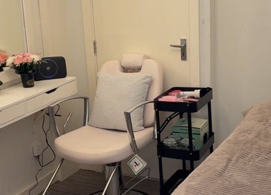 Tranquil treatment room at Beautybycodiex_ in Warrington, England, GB, featuring a comfy chair and floral decor.