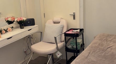 Tranquil treatment room at Beautybycodiex_ in Warrington, England, GB, featuring a comfy chair and floral decor.
