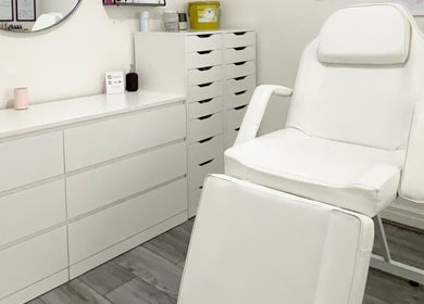 Modern white treatment chair at Lash & Line Studio, Wigan, England, GB, offering a serene and clean ambiance.