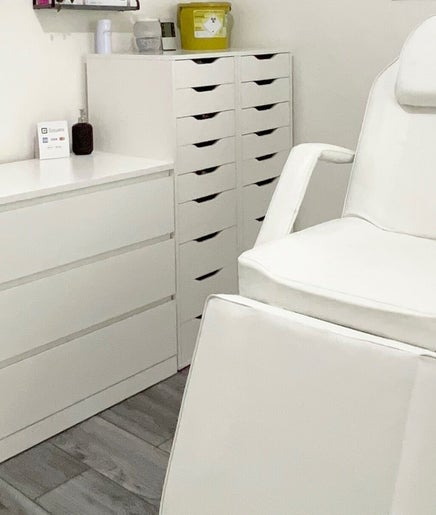 Modern white treatment chair at Lash & Line Studio, Wigan, England, GB, offering a serene and clean ambiance.