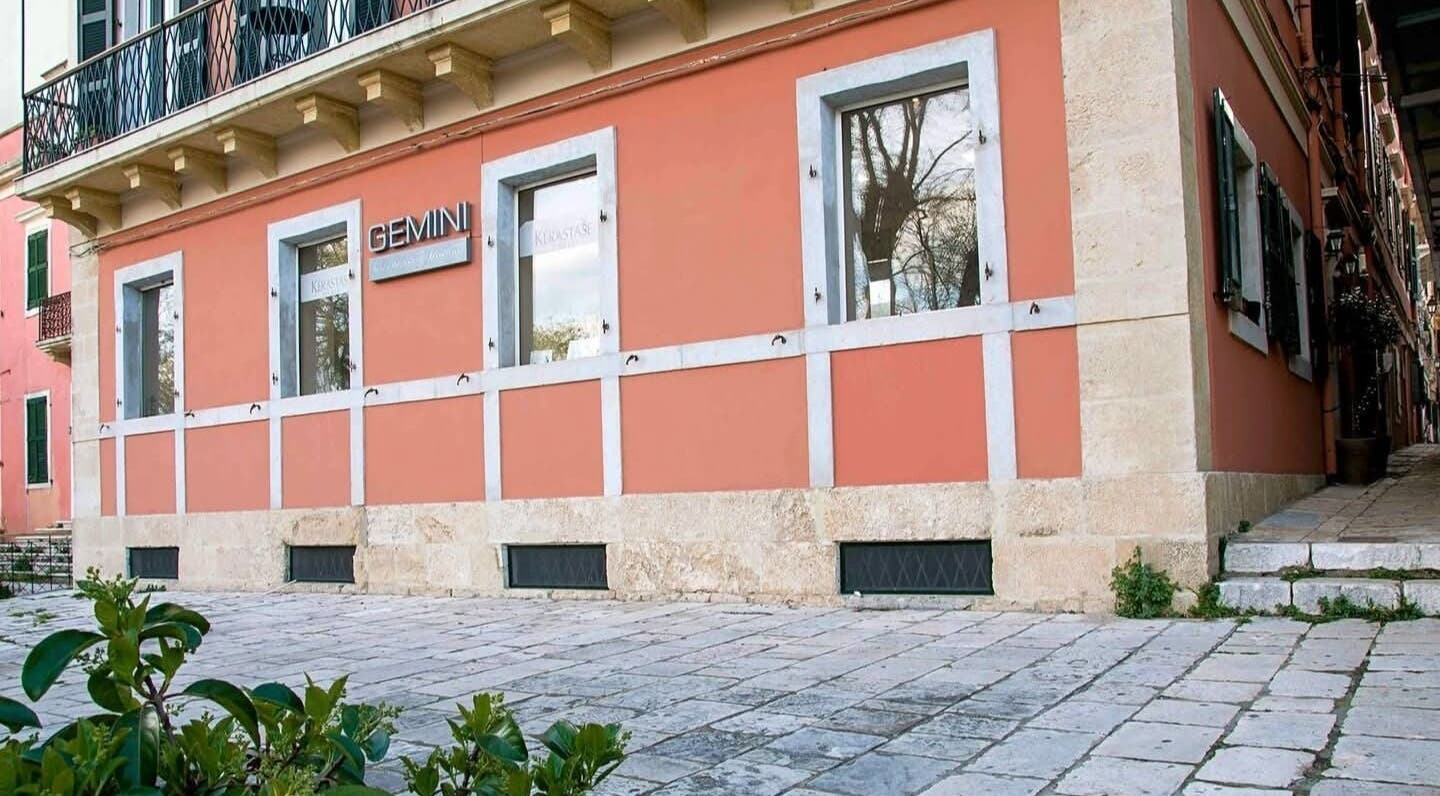 Front view of Konstantinos Mourmouris in Κέρκυρα, GR with terracotta walls and large windows.