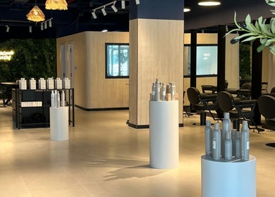 Modern interior of Hairchef & Dociä Salon LLC with sleek furniture in Dubai, AE.