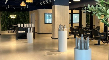 Modern interior of Hairchef & Dociä Salon LLC with sleek furniture in Dubai, AE.
