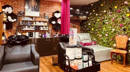 Interior of Pink Blink The Beauty Lounge in Dubai, AE featuring stylish decor and beauty products.