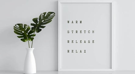 Calming decor with white vase and framed words at WellBalance Health Therapies, Edinburgh, Scotland, GB.