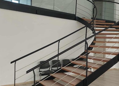 Elegant spiral staircase at Endurance Physio, Strovolos, Lefkosia, CY, enhancing modern interior space.