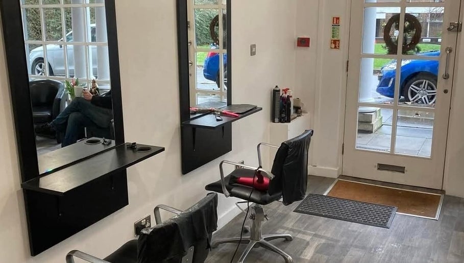Inside Hollies Beauty Room, Hatfield, England, GB: modern salon chairs, mirrors, and a welcoming atmosphere.