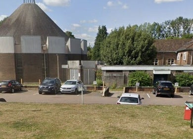 Front of Hollies Beauty Room in Hatfield, England, GB with parking and greenery around.