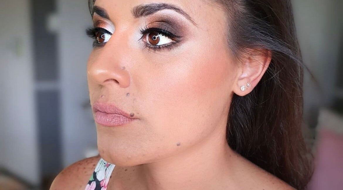Woman's elegant makeup at Luxx Artistry, Germiston, Gauteng, ZA showcasing flawless contouring and eye details.