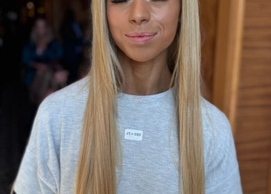 Close-up of a serene woman with long blonde hair at Luxx Artistry, Germiston, Gauteng, ZA.