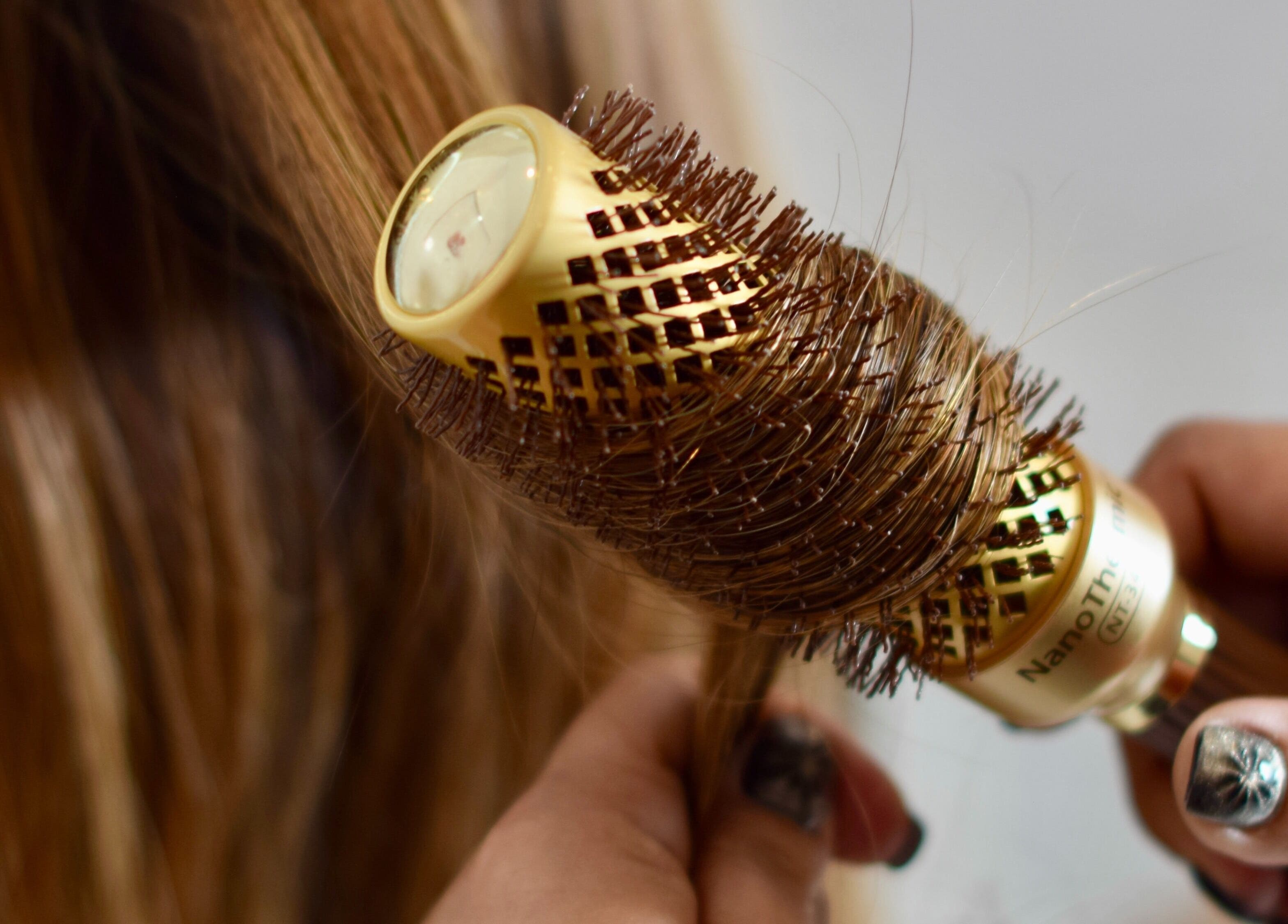 Professional hair styling at Maison De Beauté, Doha, Doha, QA, featuring luxurious brushwork for sleek hair.