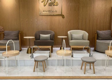 Chic pedicure area at Viola Beauty Salon, Al Mubarraz, Eastern Province, SA, with stylish seating and foot baths.