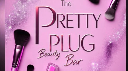 The Pretty Plug Beauty Bar logo with brushes, Pietermaritzburg, Kwazulu-natal, ZA. Pink backdrop with makeup tools.