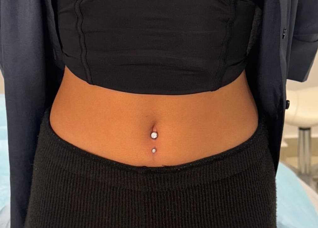 Stylish navel piercing at Monkey Piercing, Salmiya, Hawalli Governorate, KW displaying a unique style.