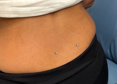 Stylish dermal piercings at Monkey Piercing, Salmiya, Hawalli Governorate, KW.