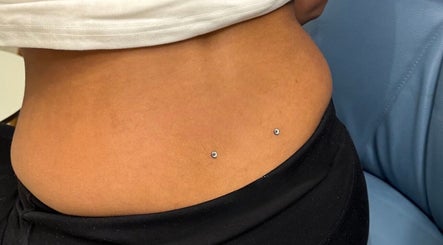 Stylish dermal piercings at Monkey Piercing, Salmiya, Hawalli Governorate, KW.