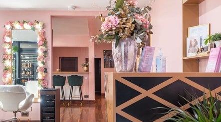 Interior of Ami Stylist in Portmore, St. Catherine Parish, JM, featuring floral decor and chic seating areas.