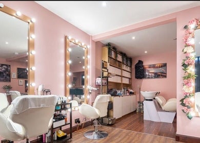 Ami Stylist salon in Portmore, St. Catherine Parish, JM with elegant mirrors and plush chairs in a chic ambiance.