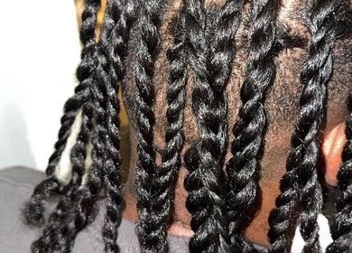 Close-up of intricate braids at Galorebeautylounge, London, England, GB, showcasing skilled hairstyling services.