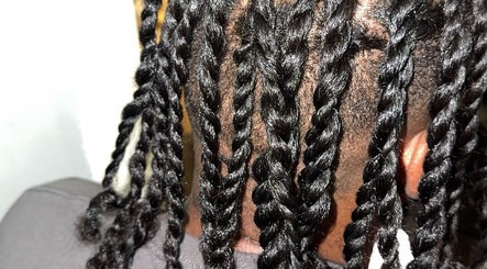 Close-up of intricate braids at Galorebeautylounge, London, England, GB, showcasing skilled hairstyling services.