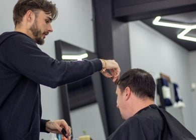 Hair stylist expertly cutting hair at Chatterbox, Lisburn, Northern Ireland, GB.