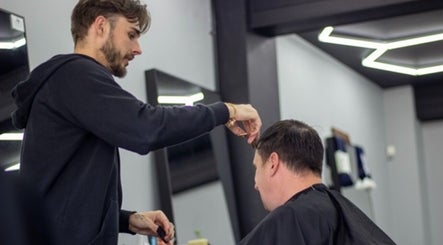 Hair stylist expertly cutting hair at Chatterbox, Lisburn, Northern Ireland, GB.