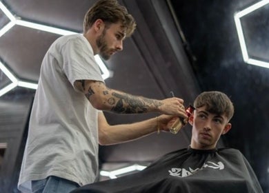 Barber styling hair at Chatterbox in Lisburn, Northern Ireland, GB.