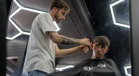 Barber styling hair at Chatterbox in Lisburn, Northern Ireland, GB.