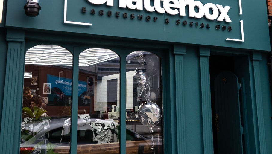 Chatterbox shopfront in Lisburn, Northern Ireland, showcasing modern barbershop setting.