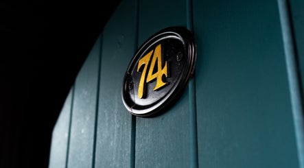Close-up of a stylish '74' doorplate at Chatterbox, Lisburn, Northern Ireland, GB.