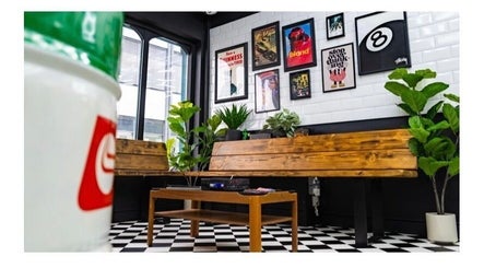 Cozy lounge seating with plants and art at Chatterbox, Lisburn, Northern Ireland, GB.