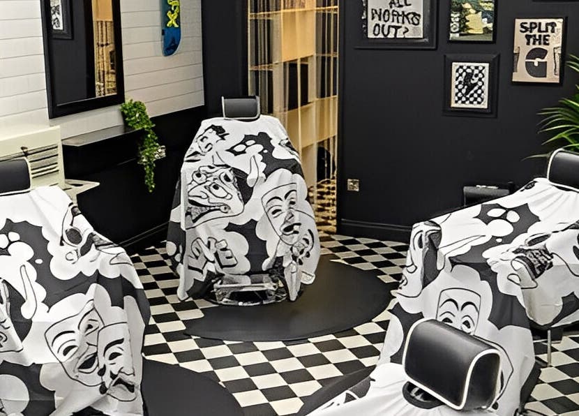 Stylish barbershop interior at Chatterbox in Lisburn, Northern Ireland, GB featuring artistic decor and chairs.