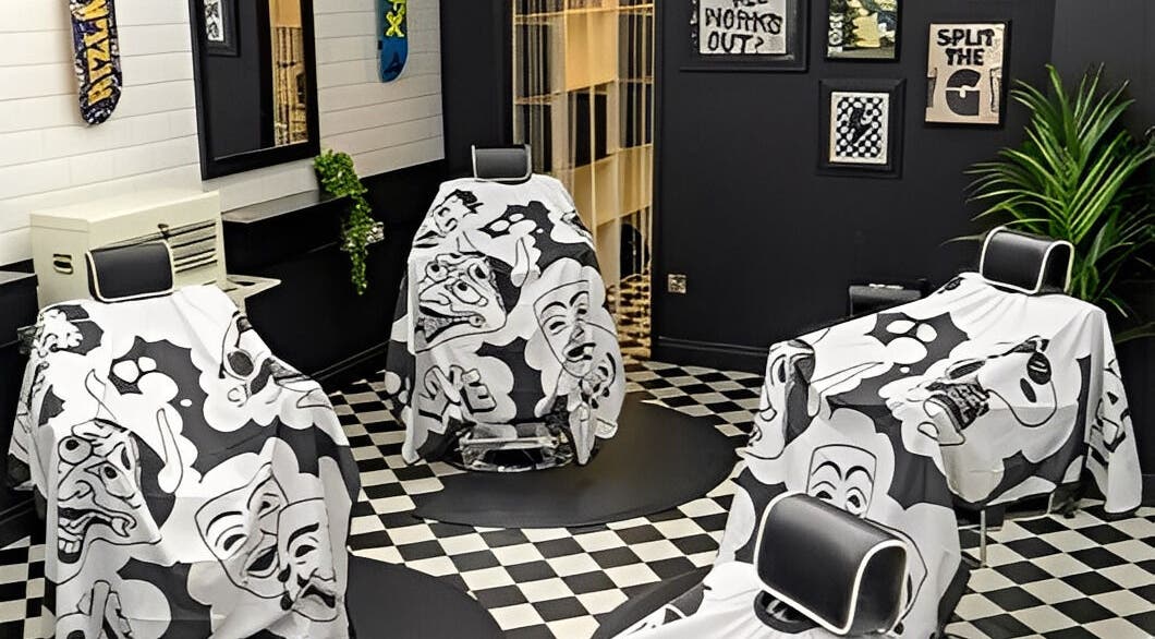 Stylish barbershop interior at Chatterbox in Lisburn, Northern Ireland, GB featuring artistic decor and chairs.