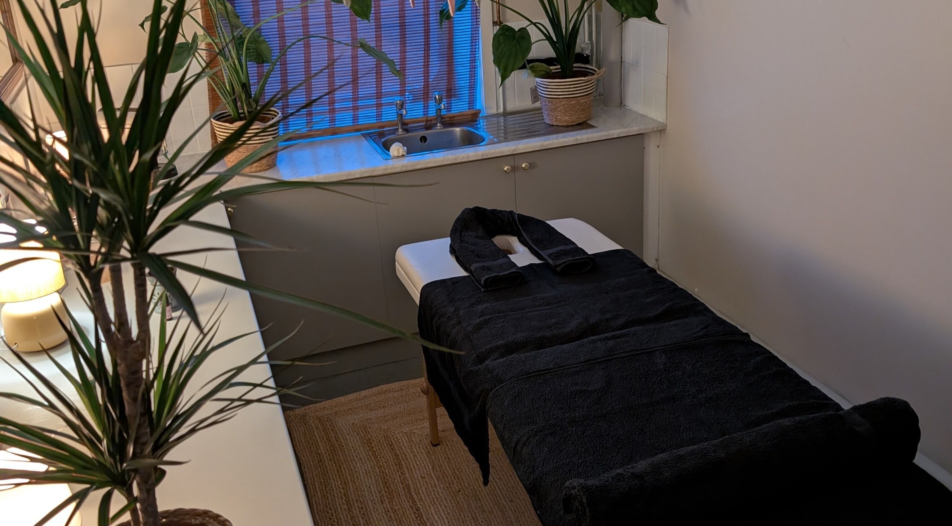 Quiet massage room at Wave Massage Studio in Portland, England, GB, with calming decor and soft lighting.
