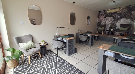 Stylish interior of Skulpted Nail Studio in George, Western Cape, ZA with modern decor and nail stations.