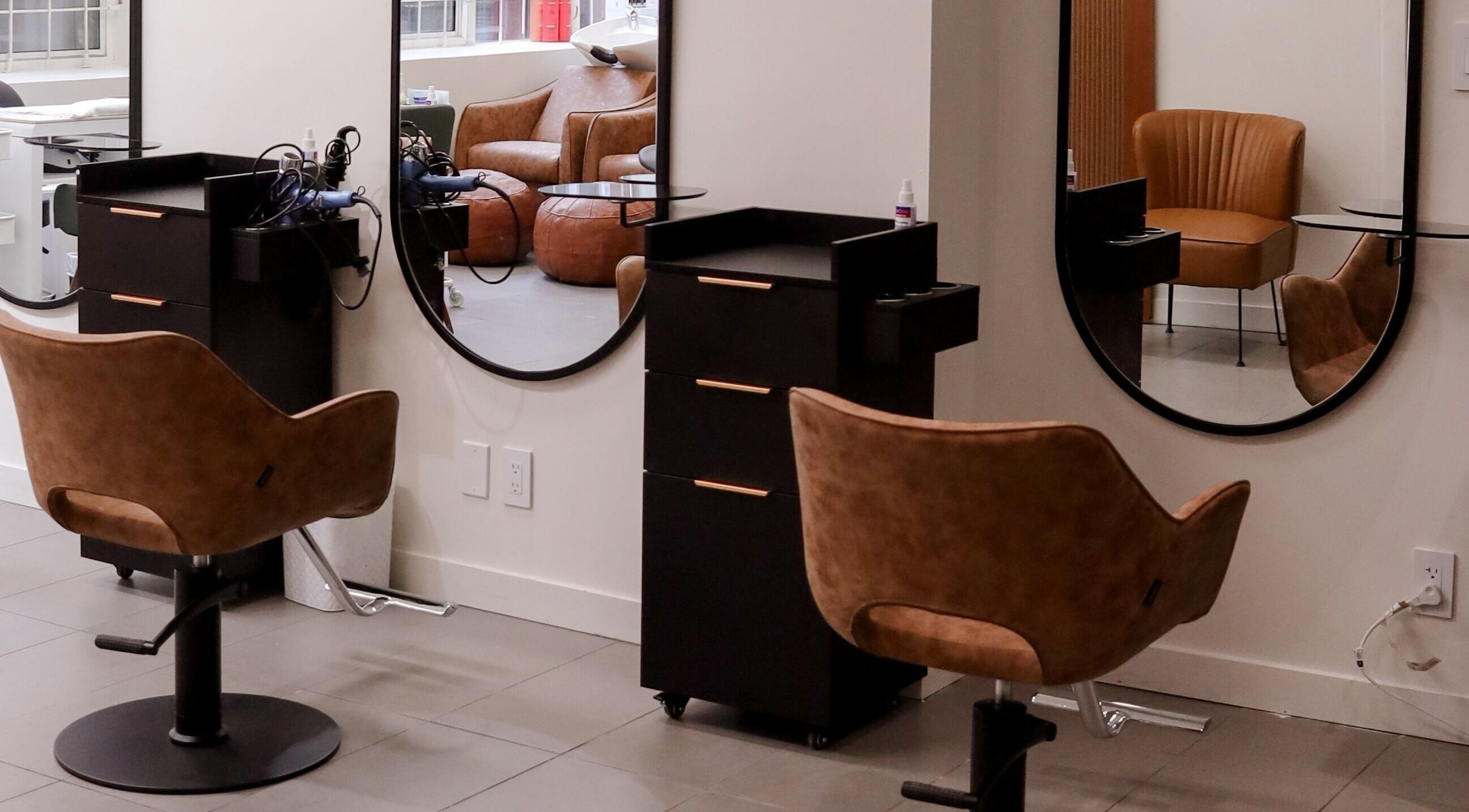 Modern styling chair and mirrors at Be salon in Vancouver, British Columbia, CA.