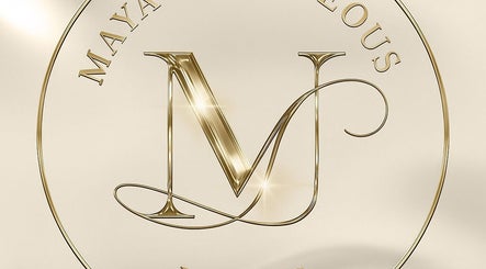 Golden logo of Maya’s Gorgeous Nails in Paramaribo, SR, showcasing luxury and elegance.