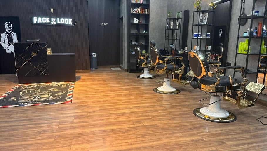 Elegant interior of Facelook barbershop in Doha, Doha Municipality, QA, featuring modern barber chairs and decor.