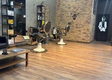Elegant barber chairs and decor at Facelook in Doha, Doha Municipality, QA for a premium grooming experience.