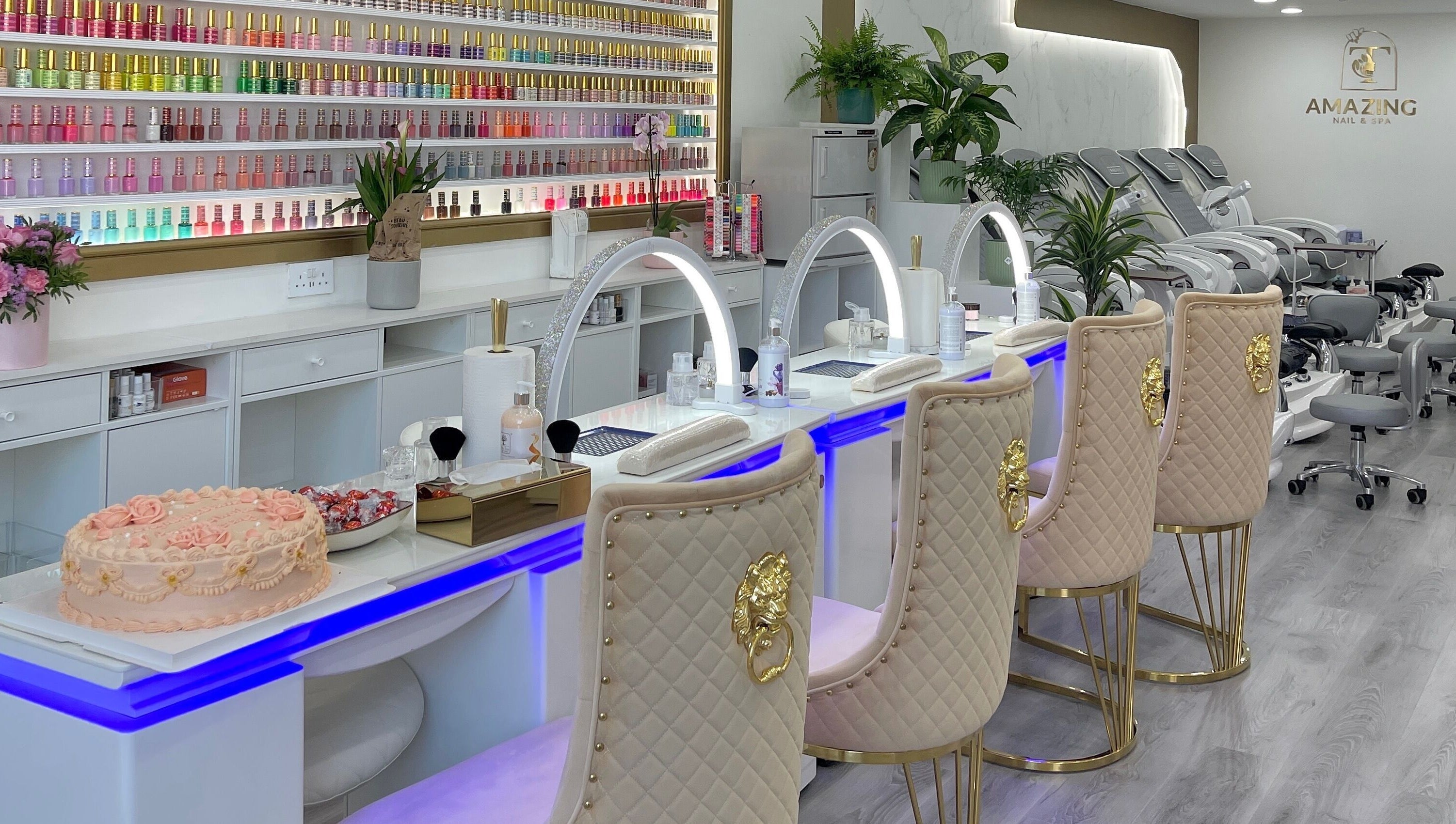 Elegant interior of Amazing Nails & Spa in Dublin, County Dublin, IE showcasing plush seating and nail polish display.