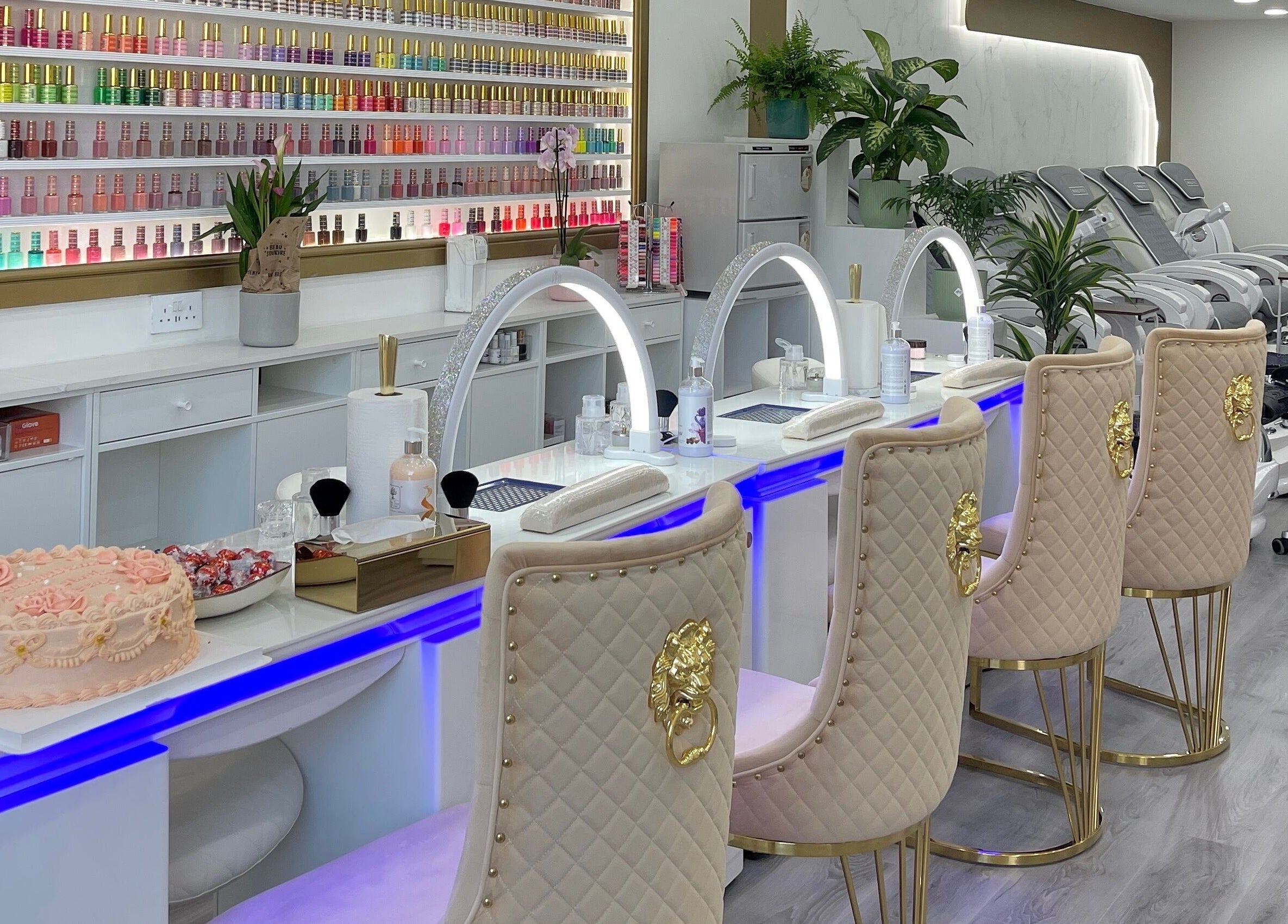 Elegant interior of Amazing Nails & Spa in Dublin, County Dublin, IE showcasing plush seating and nail polish display.