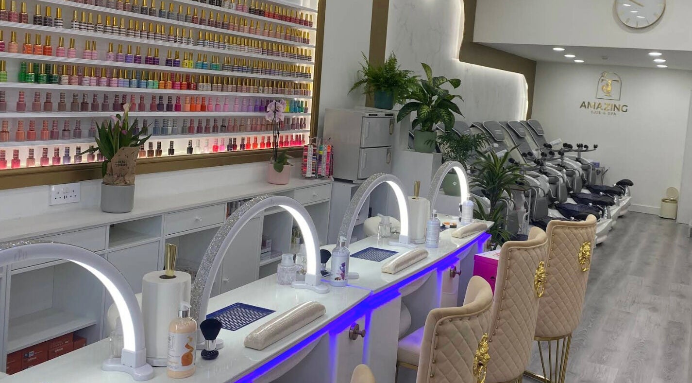 Sleek and modern interior of Amazing Nails & Spa in Dublin, County Dublin, IE featuring nail stations and polish display.
