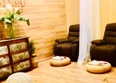Tranquil massage room at Thai Metha Massage, North Adelaide, South Australia, AU with cozy chairs and decor.