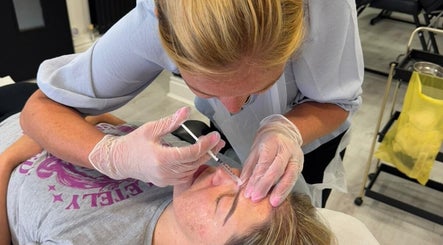 Aesthetic treatment at Angel Face, Shildon, England. Therapist administering care with precision.