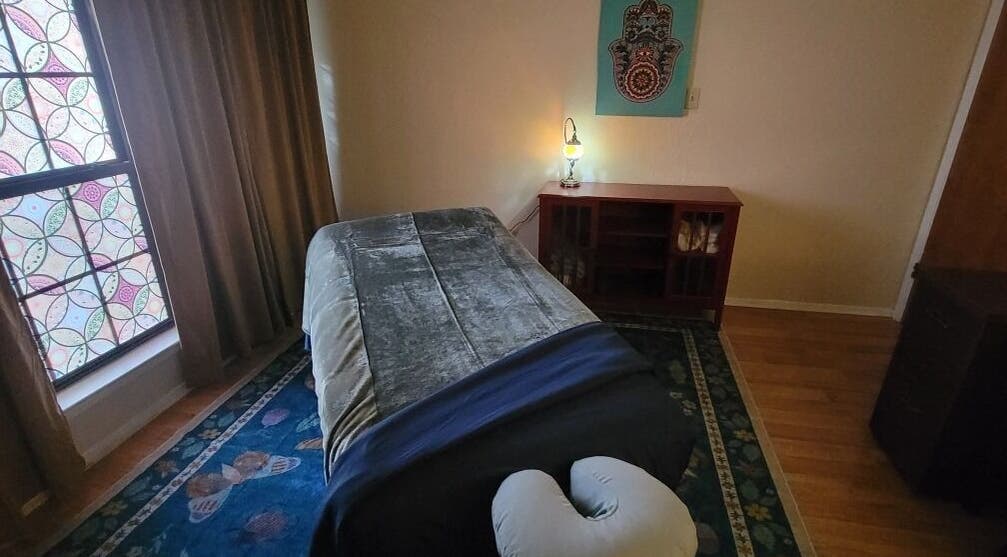 Cozy massage room at Claudia Gomez, LMT in Austin, Texas, US featuring calming decor and a comfortable massage table.