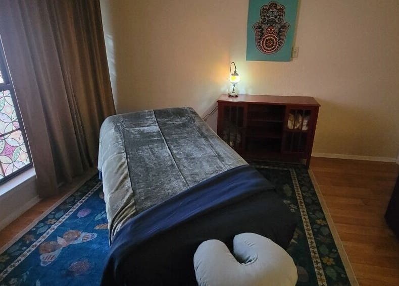 Cozy massage room at Claudia Gomez, LMT in Austin, Texas, US. Features a serene setup with a massage table.
