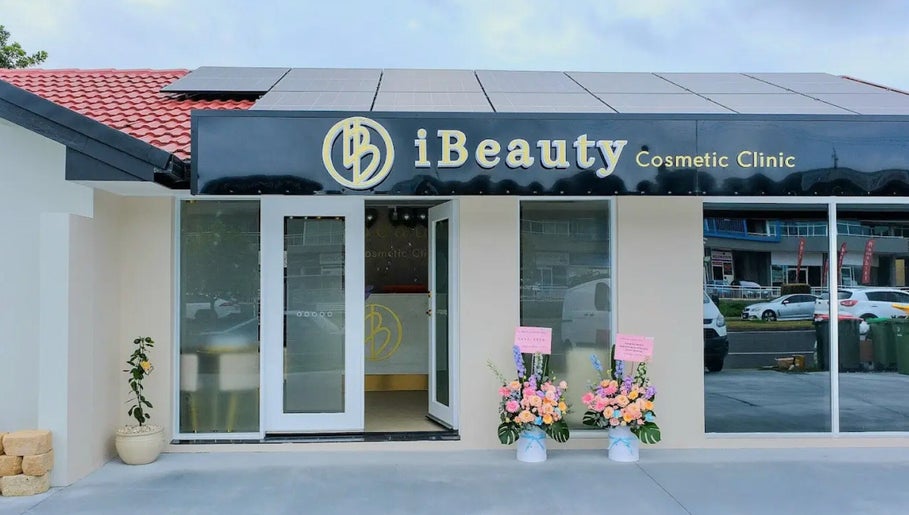 Front entrance of iBeauty Cosmetic Clinic, Bundall, Queensland, AU, showcasing sleek modern exterior.