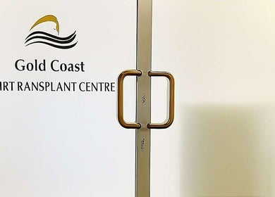 Entrance of Gold Coast Hair Transplant Centre in Southport, Queensland, AU with sleek door handles.