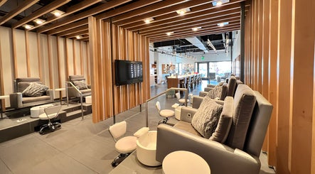 Luxury nail salon interior at It's Nailsdate in Scottsdale, Arizona. Cozy seating with plush chairs and modern decor.